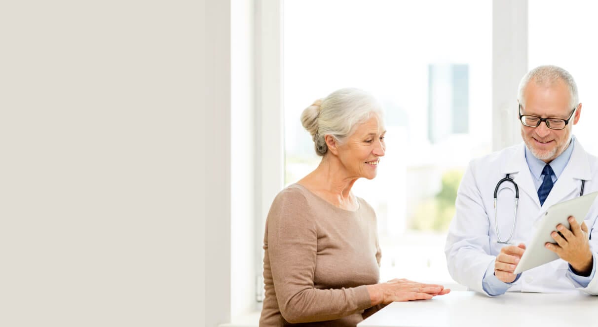 A patient reviewing her progress with her physician